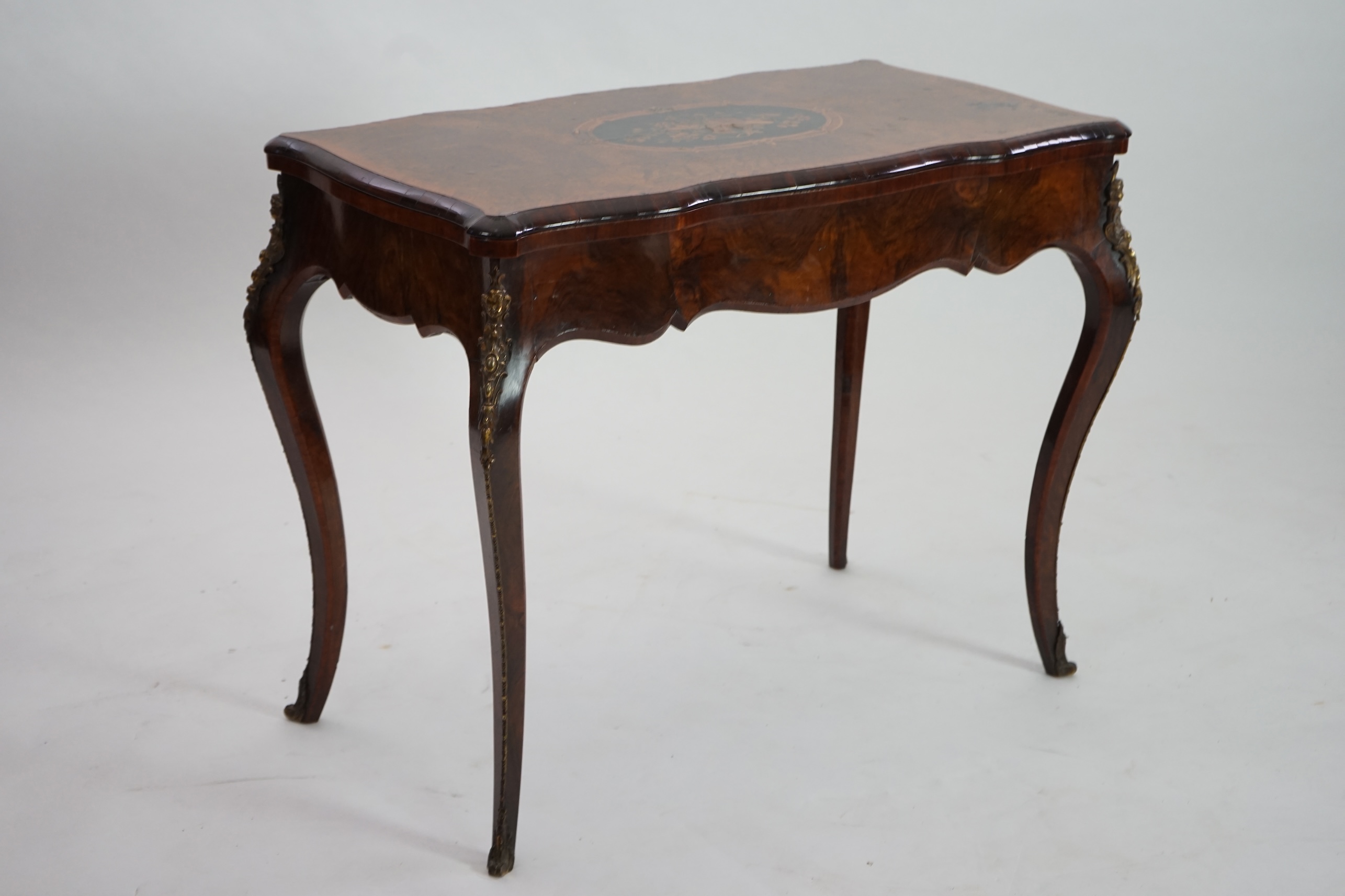 A Victorian marquetry inlaid burr walnut card table